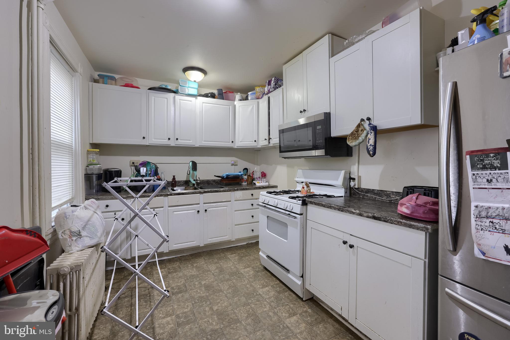 670 Hebrank Street Lancaster, PA 17603 - Photo 9 of 22 a kitchen with stainless steel appliances a stove a sink cabinets and a refrigerator