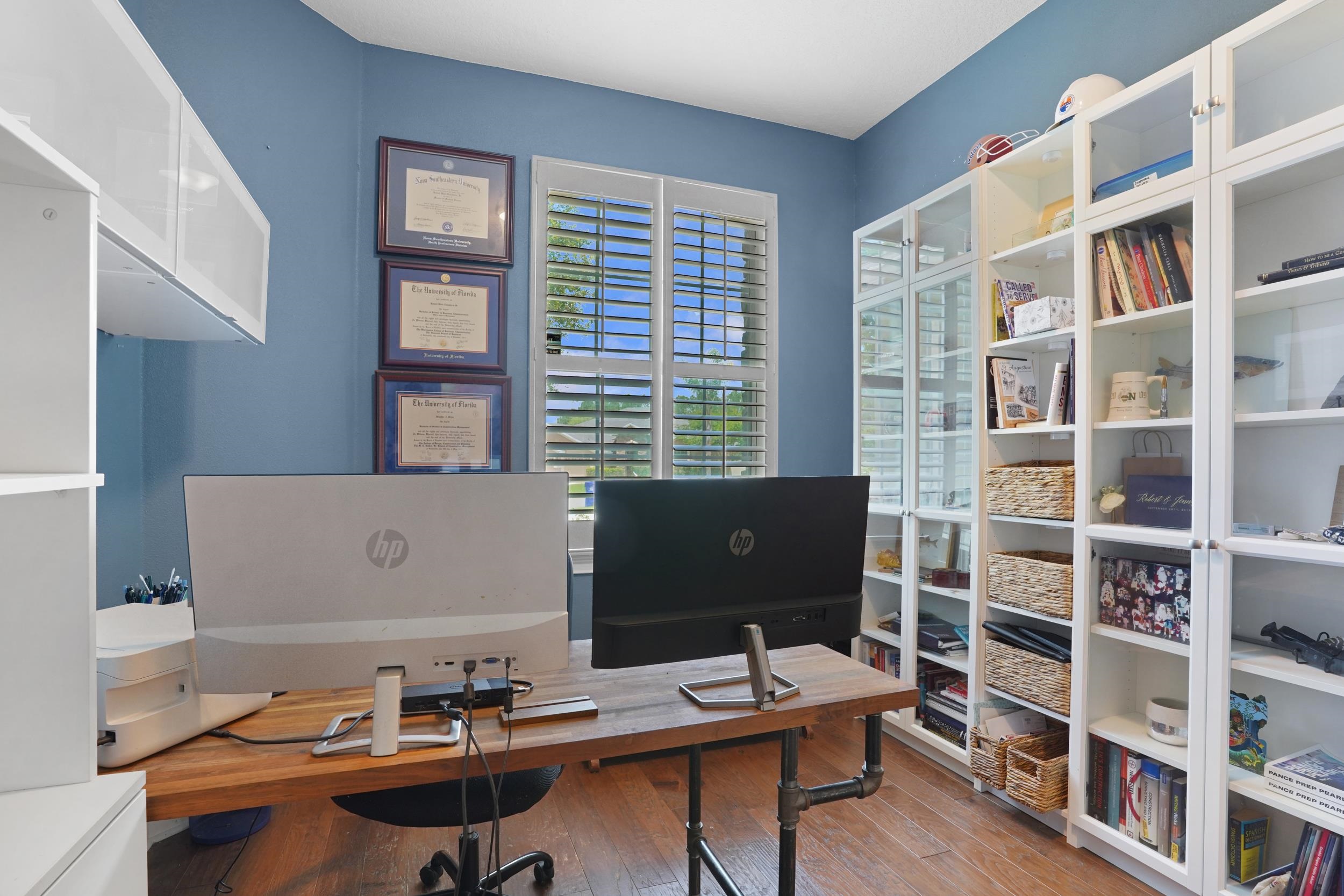1308 Acorn Ridge Court St. Augustine, FL 32092 - Photo 16 of 47 a view of a workspace with furniture and a bookshelf