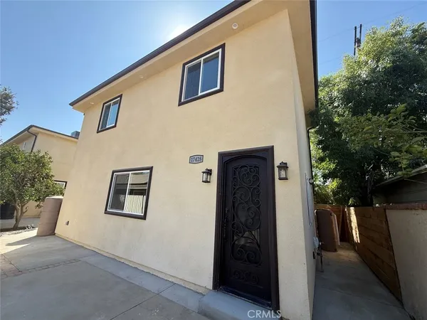 a view of a house with a tree