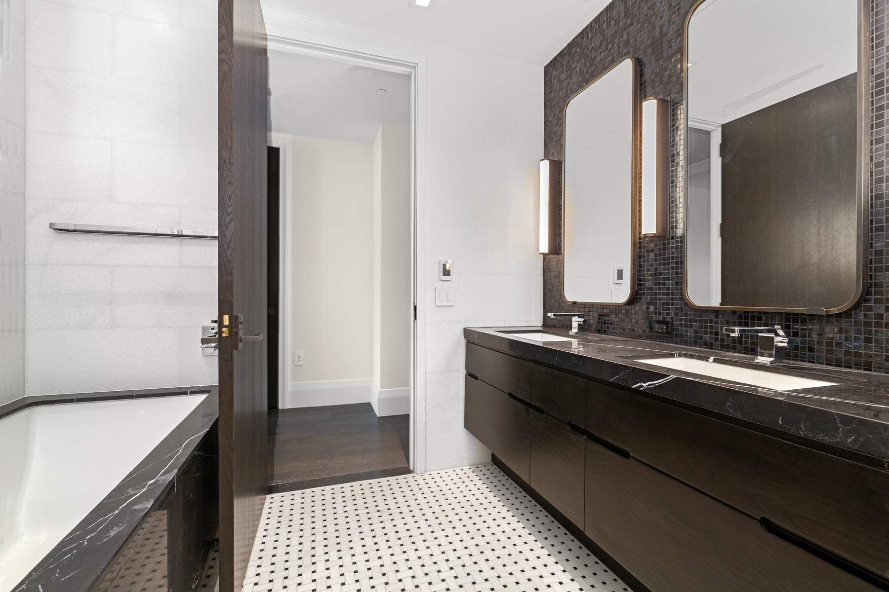 172 Madison Avenue, Unit 8B Manhattan, NY 10016 - Photo 5 of 11 a bathroom with a double vanity sink and mirror