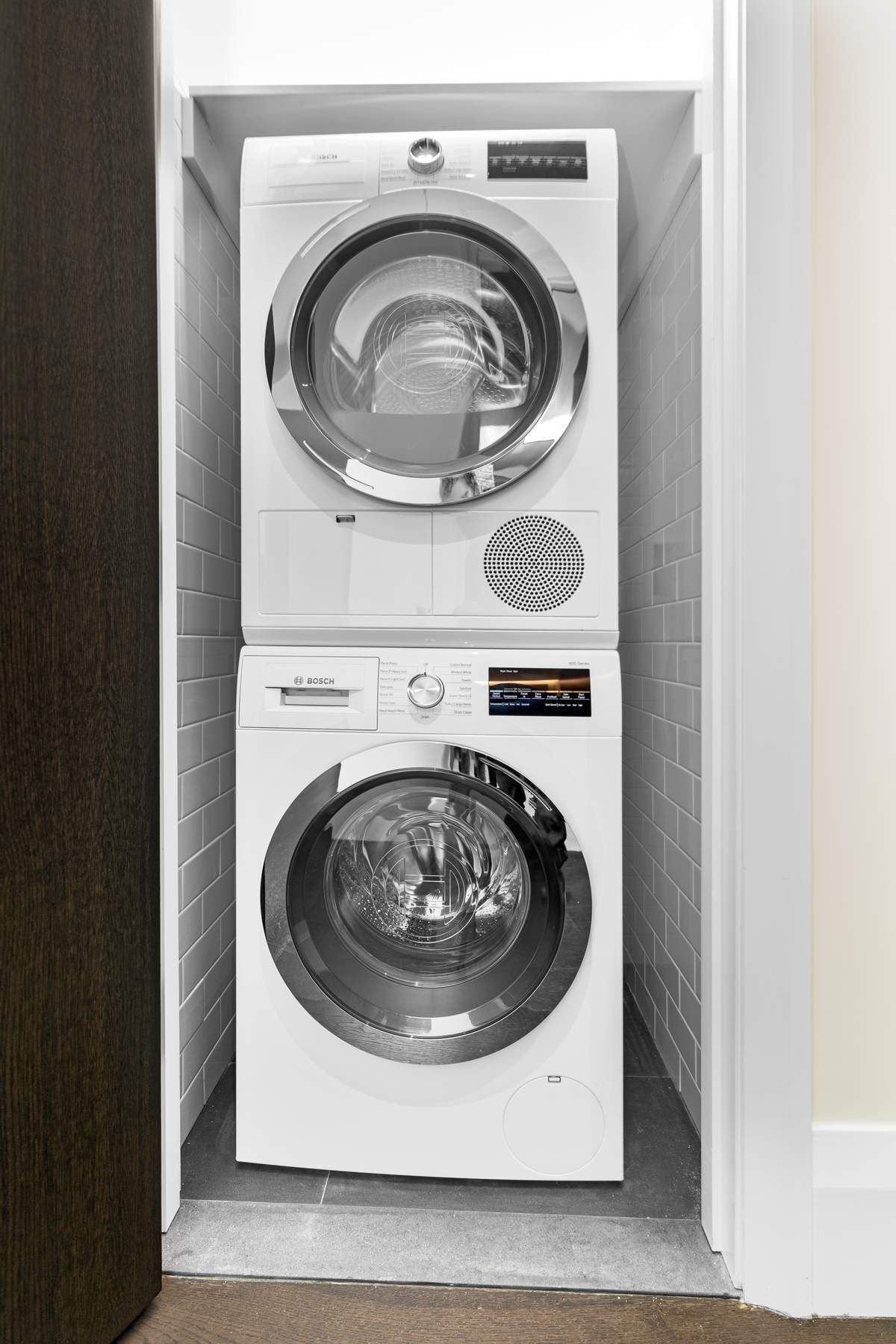 172 Madison Avenue, Unit 8B Manhattan, NY 10016 - Photo 8 of 11 a utility room with dryer and washer