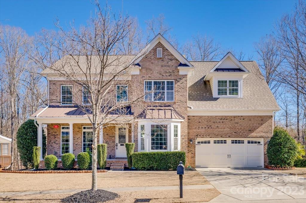368 Windell Drive Fort Mill, SC 29708 - Photo 1 of 48 a front view of a house with a garden