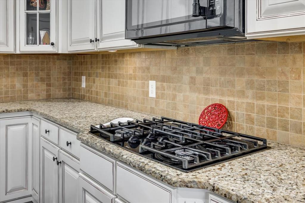 368 Windell Drive Fort Mill, SC 29708 - Photo 11 of 48 a kitchen with a stove and cabinets