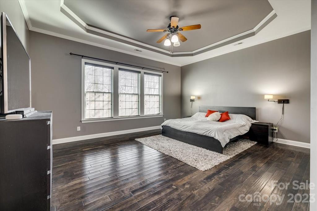 368 Windell Drive Fort Mill, SC 29708 - Photo 15 of 48 a bedroom with a bed and a chandelier