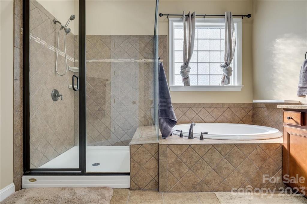 368 Windell Drive Fort Mill, SC 29708 - Photo 17 of 48 a bathroom with a bathtub and a shower