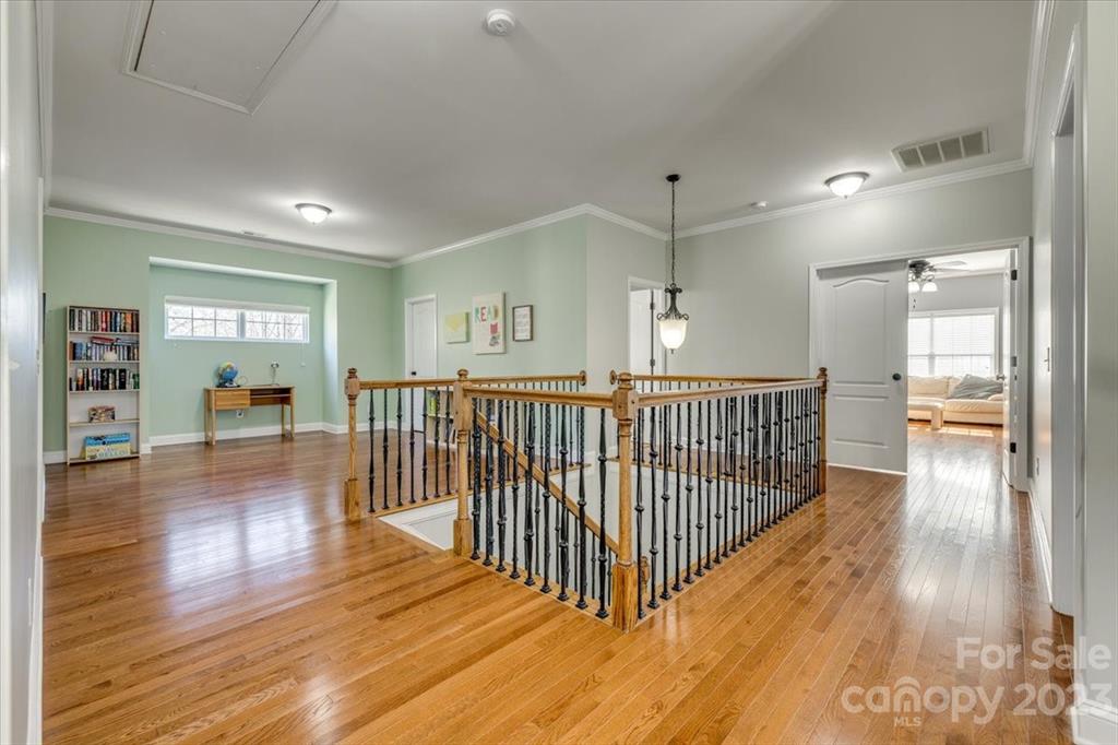 368 Windell Drive Fort Mill, SC 29708 - Photo 23 of 48 a view of a hallway view with wooden floor and staircase