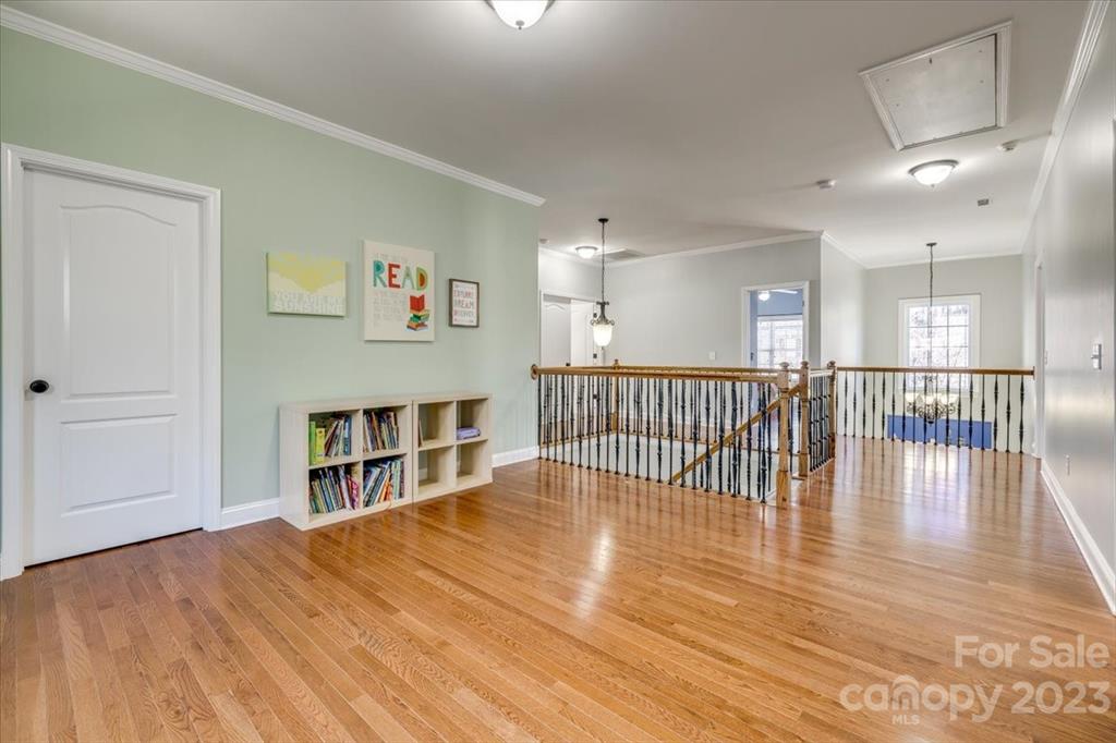 368 Windell Drive Fort Mill, SC 29708 - Photo 24 of 48 a view of a hallway with wooden floor and windows