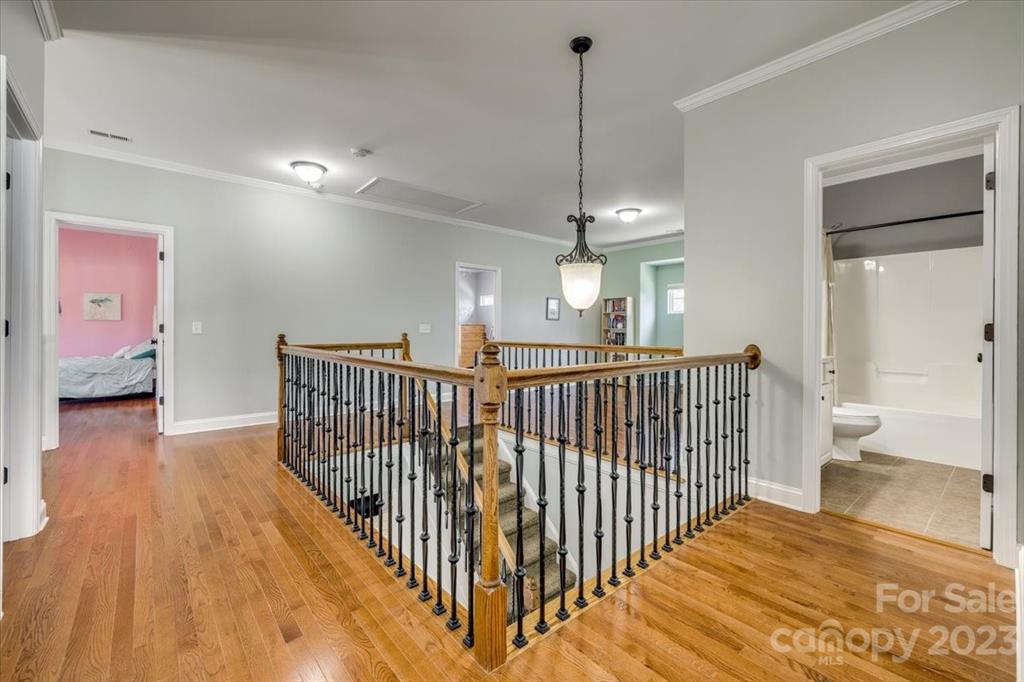 368 Windell Drive Fort Mill, SC 29708 - Photo 31 of 48 a view of a hallway view with wooden floor and staircase