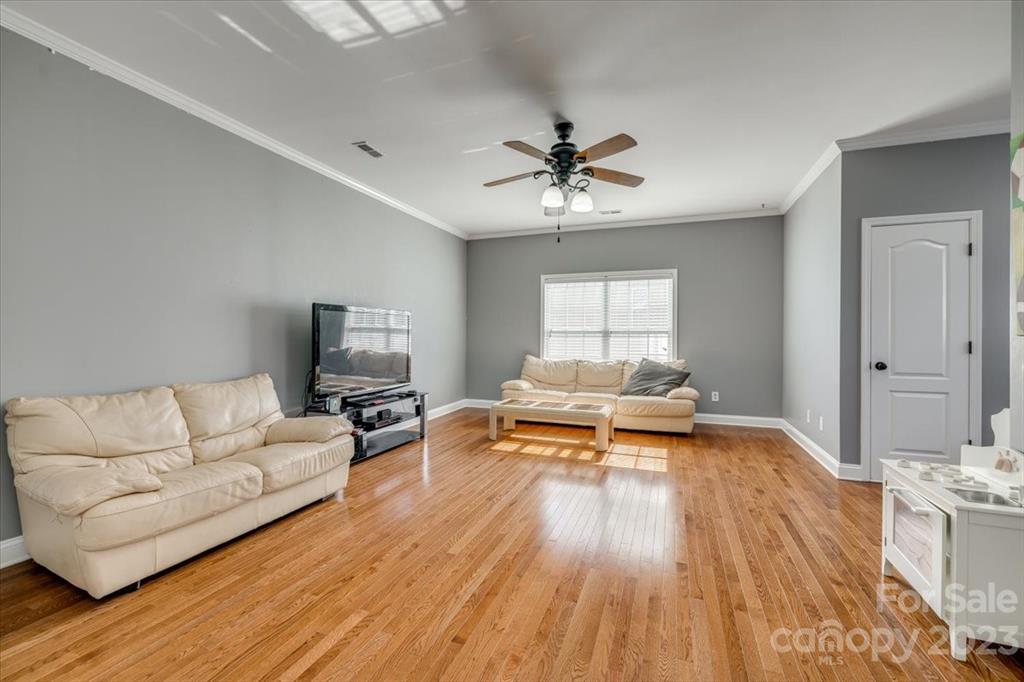 368 Windell Drive Fort Mill, SC 29708 - Photo 33 of 48 a living room with furniture and a wooden floor