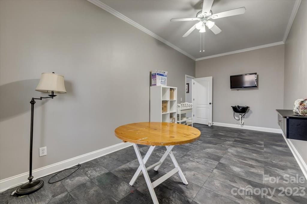 368 Windell Drive Fort Mill, SC 29708 - Photo 37 of 48 a living room with furniture a dining table and a chandelier