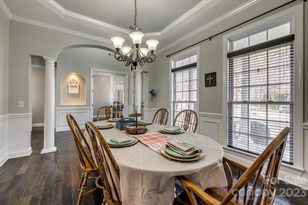 368 Windell Drive Fort Mill, SC 29708 - Photo 4 of 48 a view of a dining room with furniture a chandelier and wooden floor