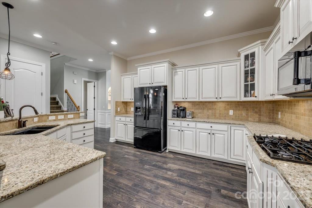 368 Windell Drive Fort Mill, SC 29708 - Photo 7 of 48 a kitchen with refrigerator and cabinets
