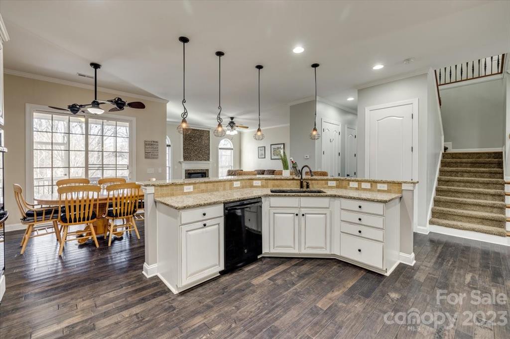 368 Windell Drive Fort Mill, SC 29708 - Photo 9 of 48 a open kitchen with stainless steel appliances granite countertop a stove and a wooden floors