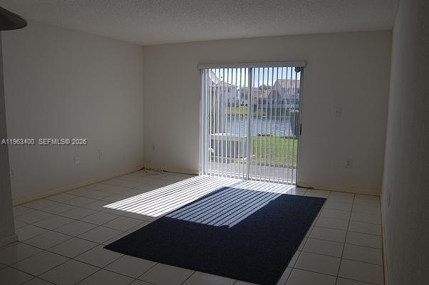 14057 Southwest 121st Place, Unit 724 Miami, FL 33186 - Photo 5 of 9 a view of a room with windows