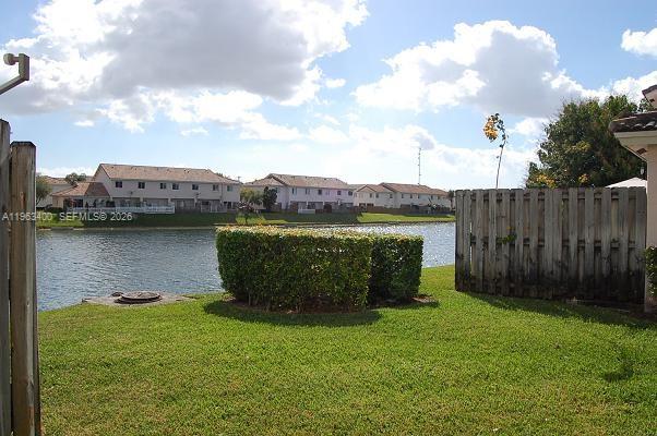 14057 Southwest 121st Place, Unit 724 Miami, FL 33186 - Photo 6 of 9 a view of a garden with lake