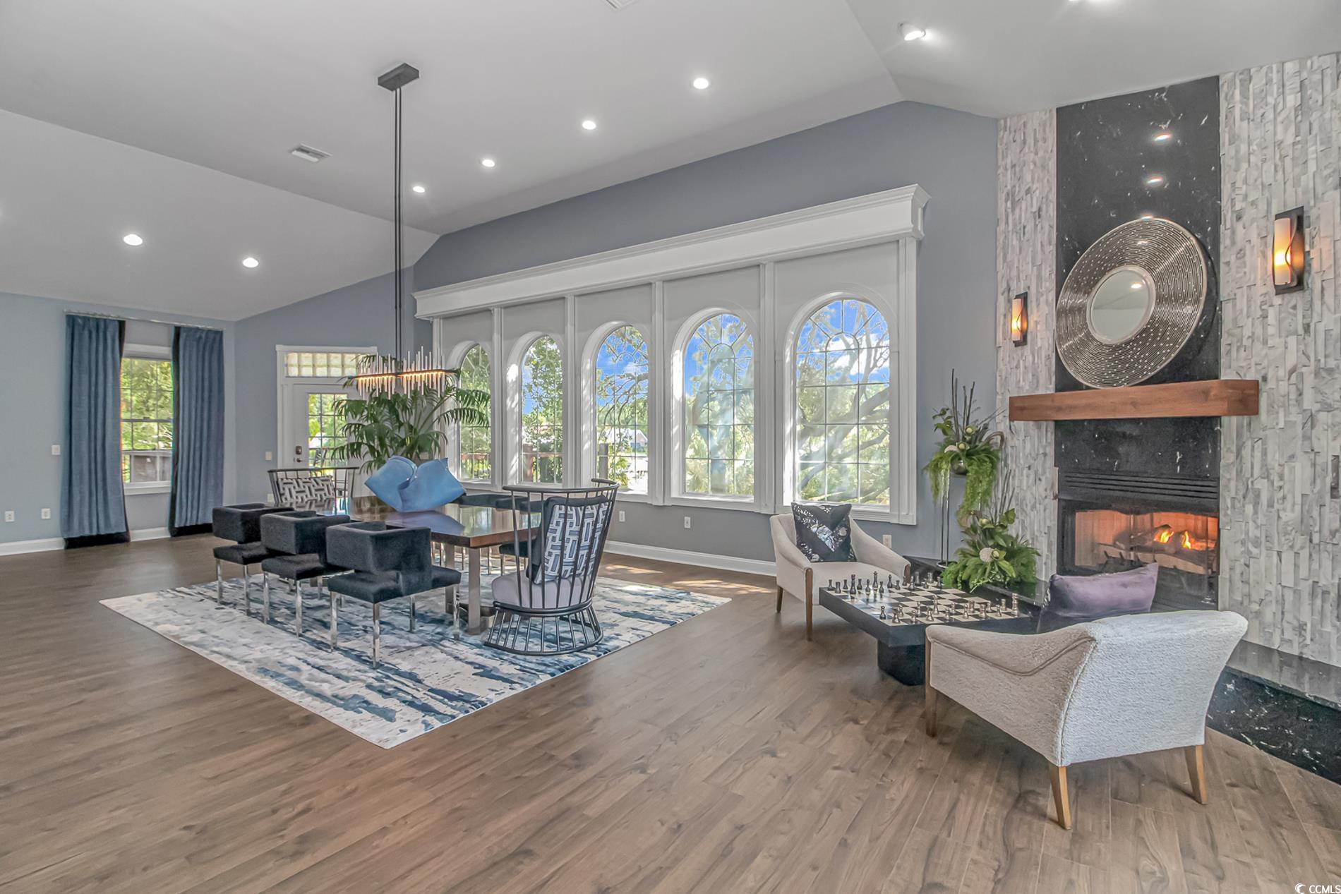 510 Rum Gully Road Murrells Inlet, SC 29576 - Photo 13 of 35 Dining room with vaulted ceiling, baseboards, wood finished floors, plenty of natural light, and recessed lighting