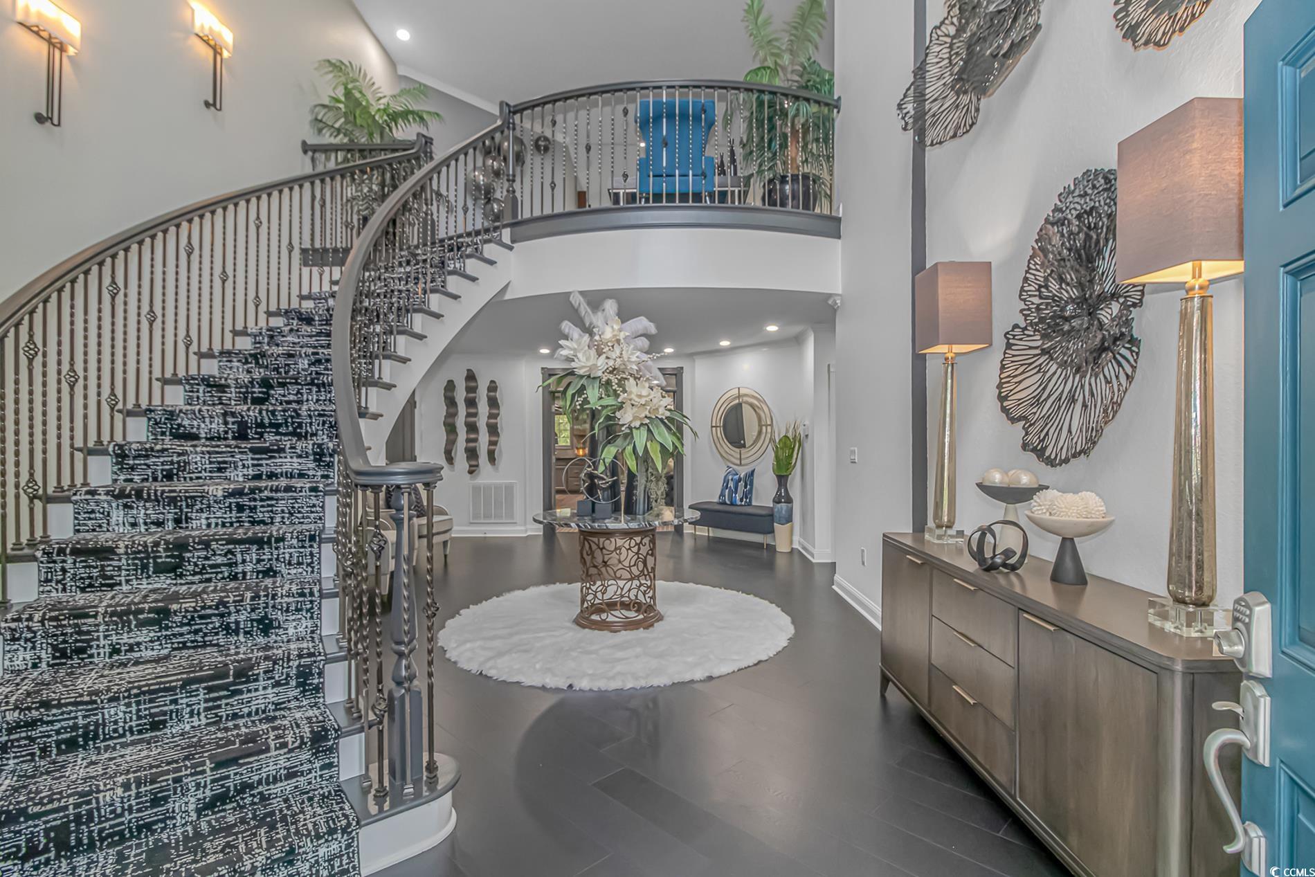 510 Rum Gully Road Murrells Inlet, SC 29576 - Photo 3 of 35 Entryway featuring stairway, a high ceiling, dark wood finished floors, baseboards, and recessed lighting