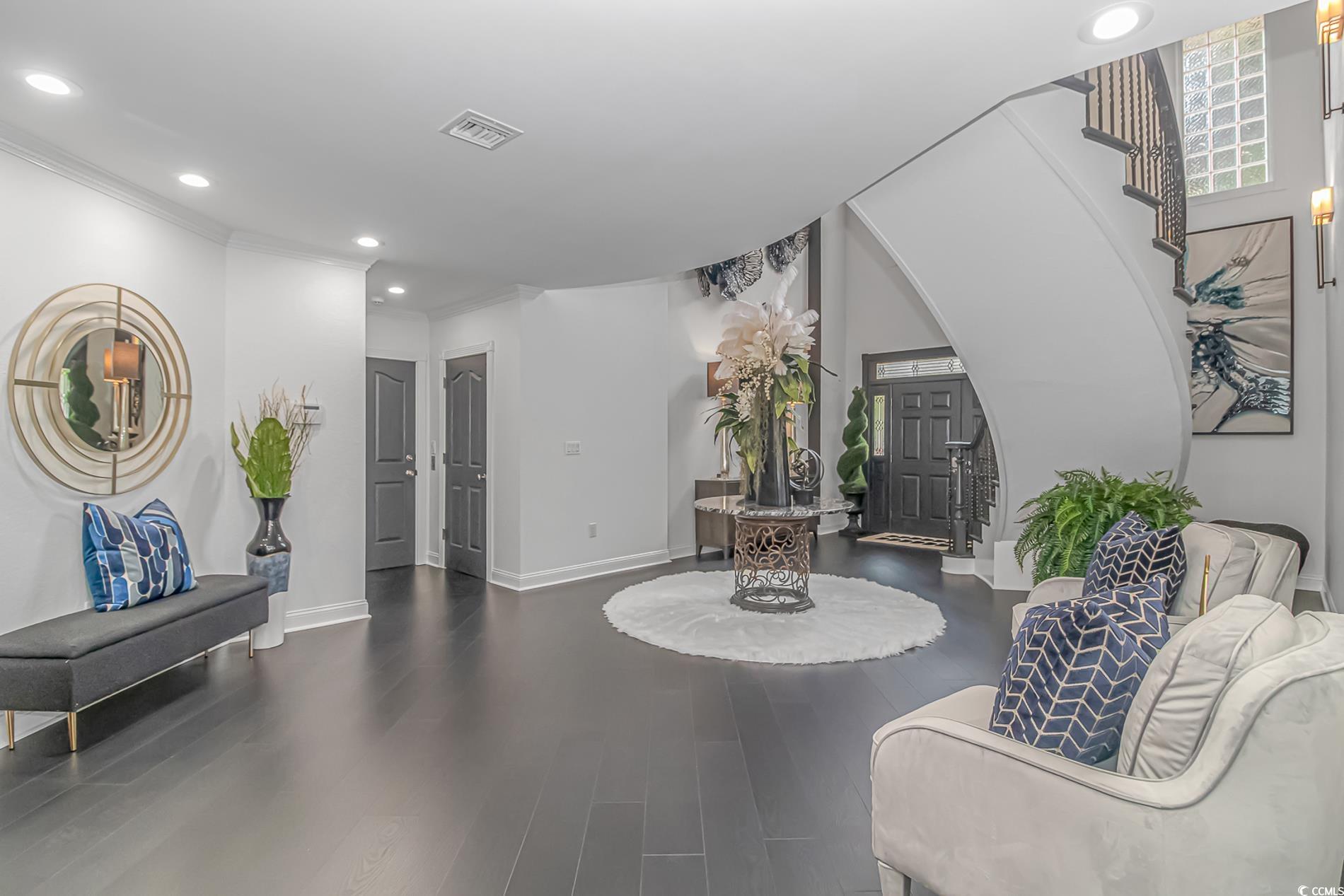 510 Rum Gully Road Murrells Inlet, SC 29576 - Photo 4 of 35 Foyer entrance featuring arched walkways, recessed lighting, wood finished floors, baseboards, and ornamental molding