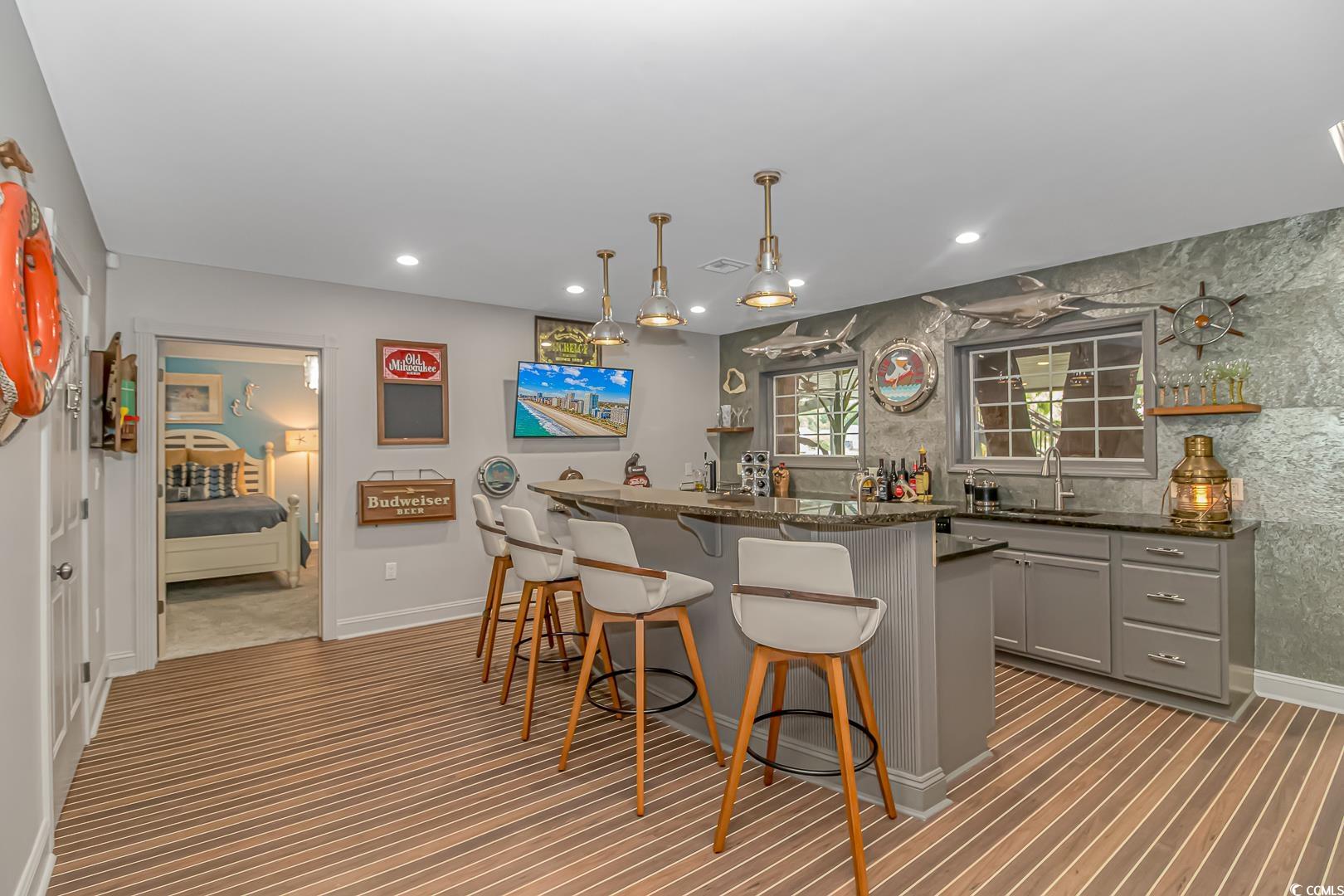 510 Rum Gully Road Murrells Inlet, SC 29576 - Photo 5 of 35 Indoor wet bar with carpet floors, recessed lighting, baseboards, and hanging light fixtures