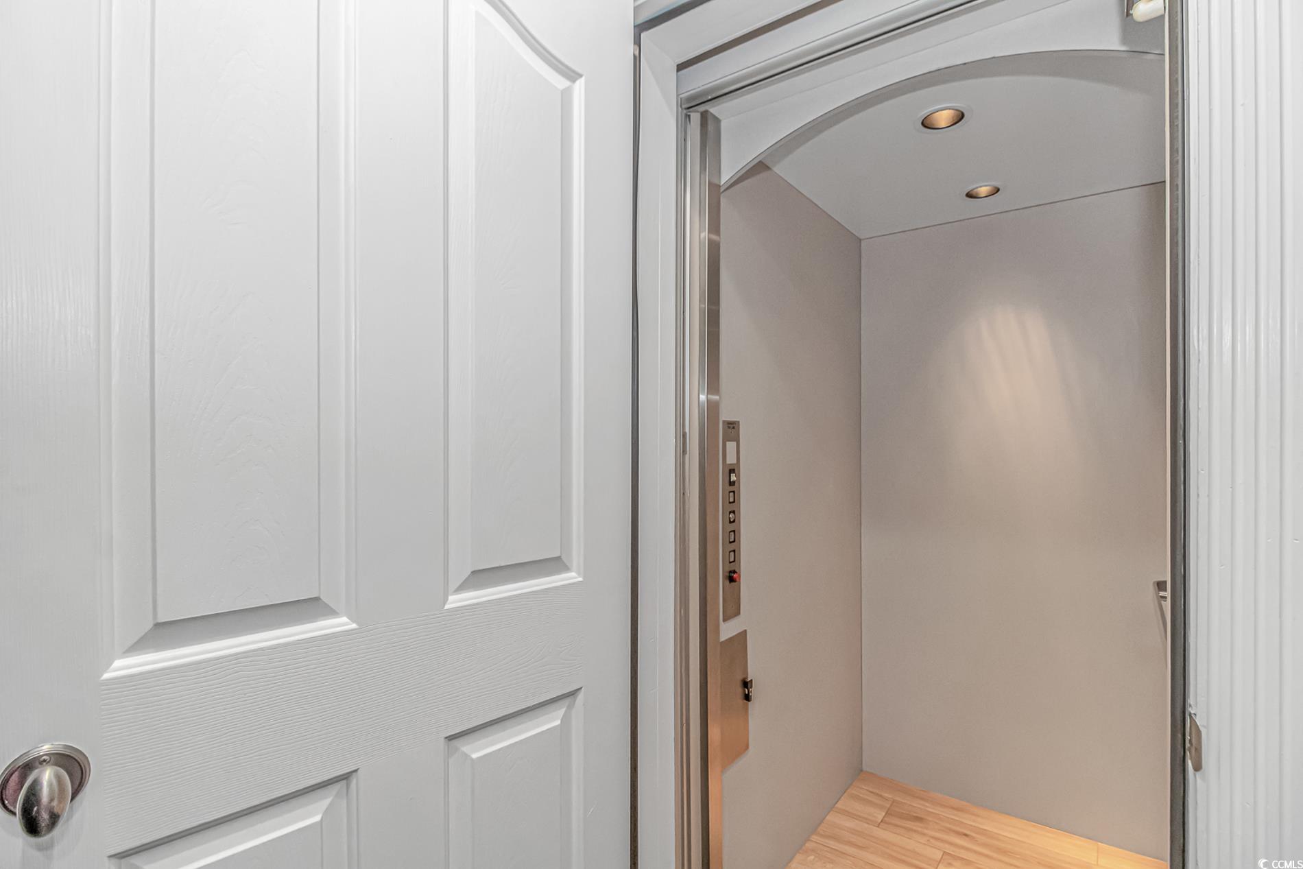510 Rum Gully Road Murrells Inlet, SC 29576 - Photo 8 of 35 Elevator featuring wood finished floors and recessed lighting