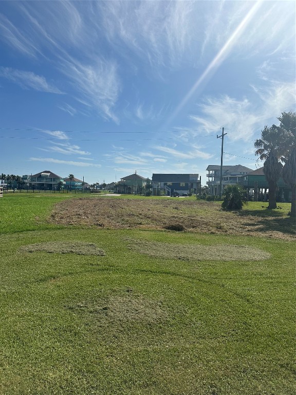 981 Sailfish Crystal Beach, TX 77650 - Photo 2 of 4 a view of a lake with a big yard