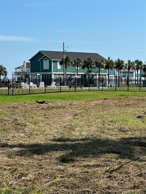 981 Sailfish Crystal Beach, TX 77650 - Photo 3 of 4 a front view of a house with a yard