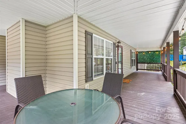 a balcony with wooden floor in outdoor space