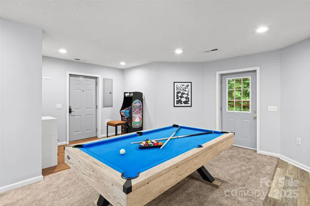 a kitchen with stainless steel appliances granite countertop a refrigerator and a stove