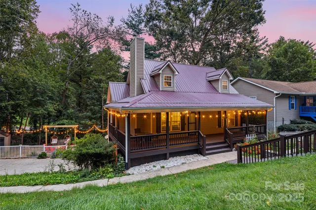 a view of a house with a yard porch and sitting area