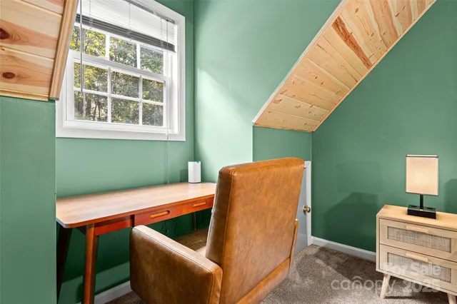 a bedroom with bed and window