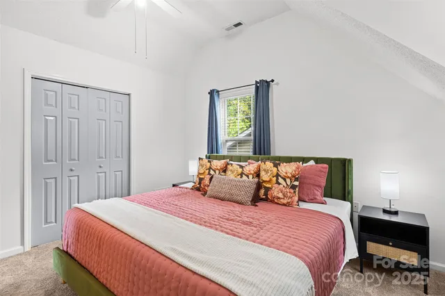 a living room with furniture and a painting