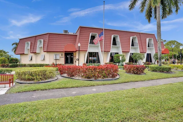 a view of a dining room with furniture and a potted plant