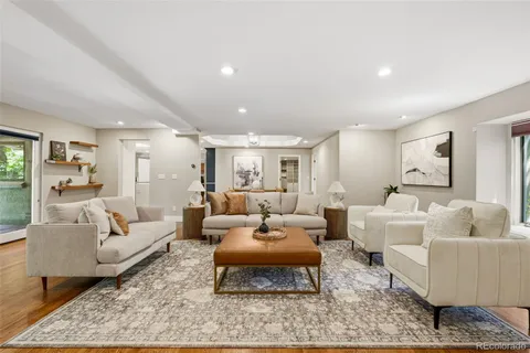 a living room with furniture lamp and rug