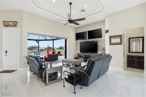 a kitchen with granite countertop white cabinets and stainless steel appliances