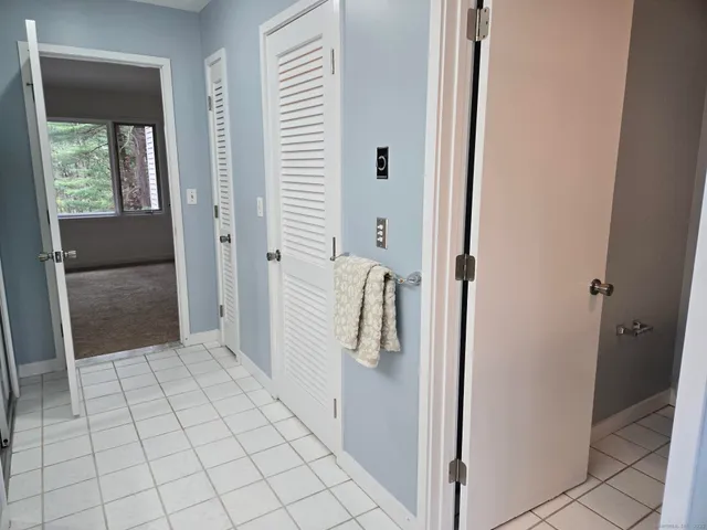 a bathroom with a sink toilet and window