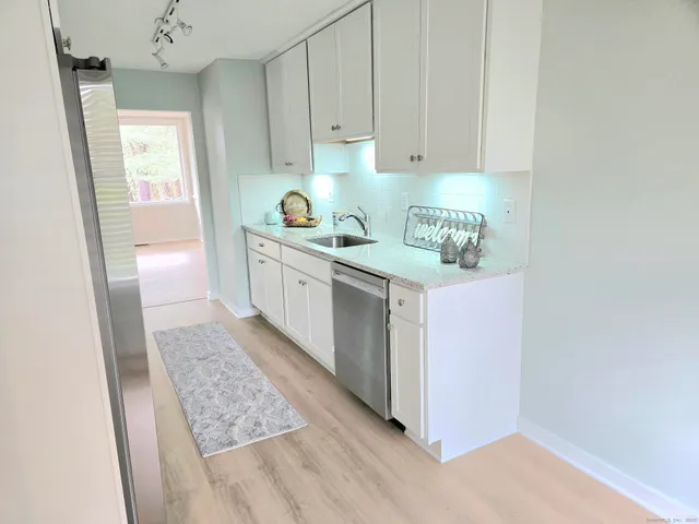 a kitchen with a sink and cabinets