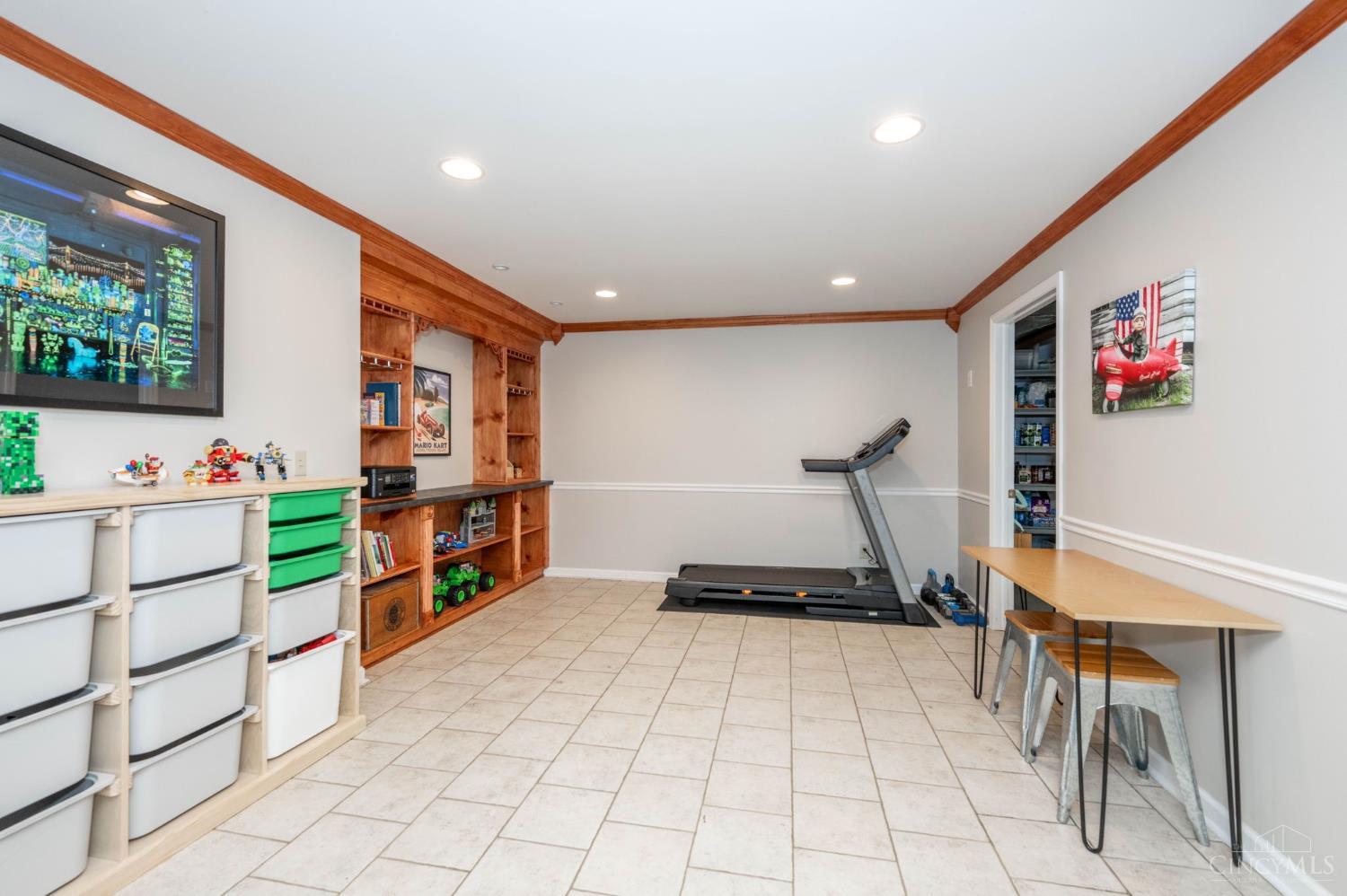 11624 Edgewood Road Harrison, OH 45030 - Photo 40 of 54 Recreation room with tile and carpet flooring.