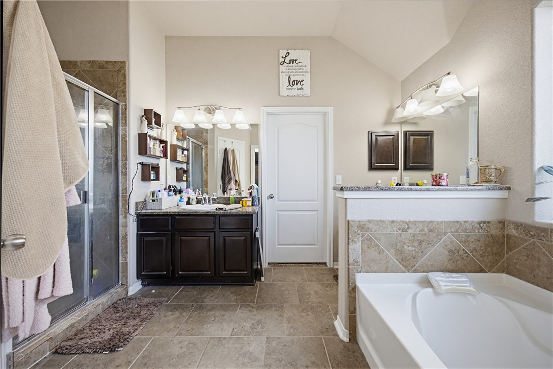 2129 Escondido Street Portland, TX 78374 - Photo 16 of 29 a en suite bathroom with a tub sink and mirror