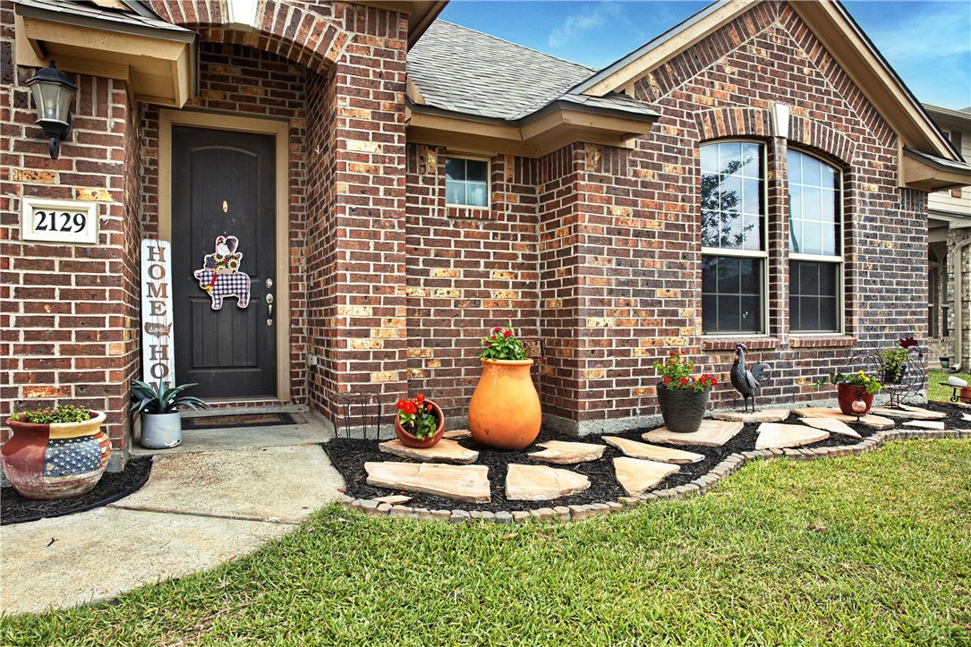 2129 Escondido Street Portland, TX 78374 - Photo 2 of 29 a front view of a house with patio