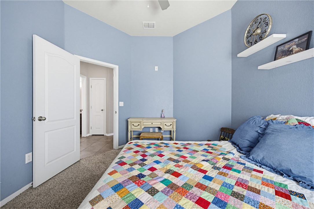 2129 Escondido Street Portland, TX 78374 - Photo 21 of 29 a bedroom with a bed and a window