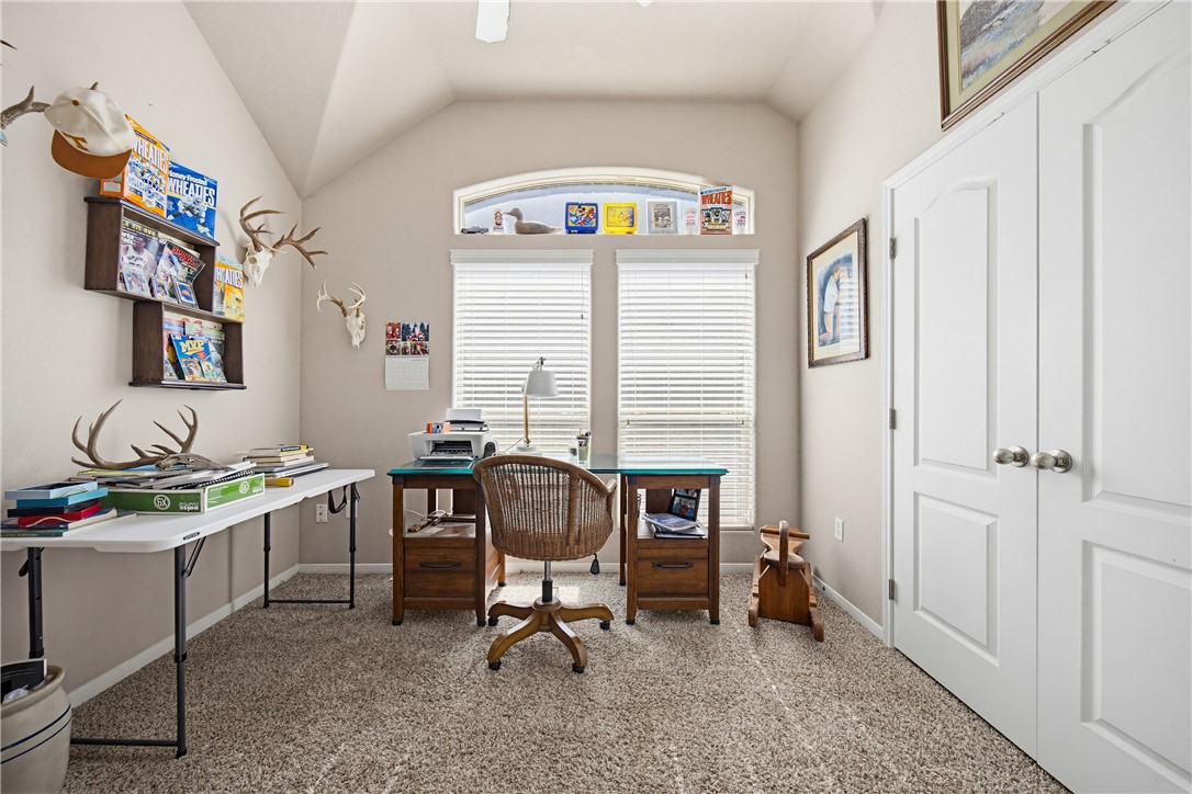 2129 Escondido Street Portland, TX 78374 - Photo 22 of 29 a view of a workspace with furniture and a window