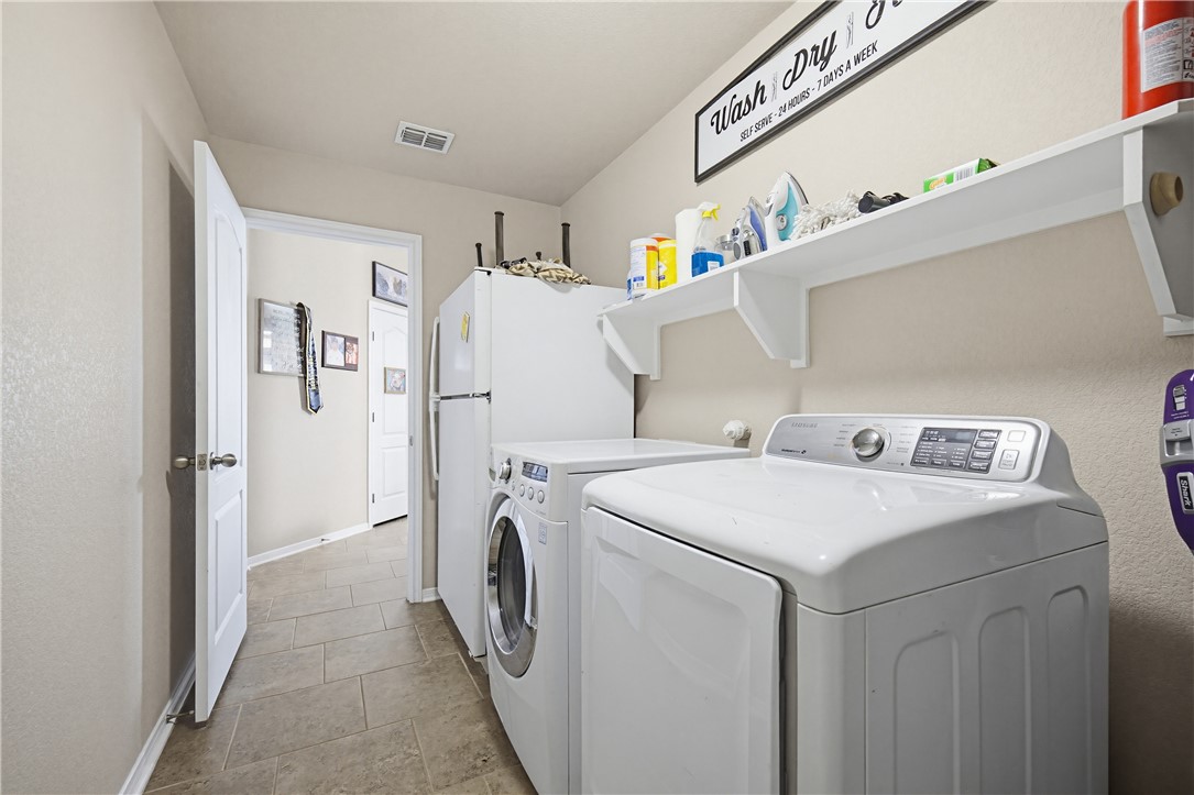 2129 Escondido Street Portland, TX 78374 - Photo 25 of 29 a utility room with dryer and washer
