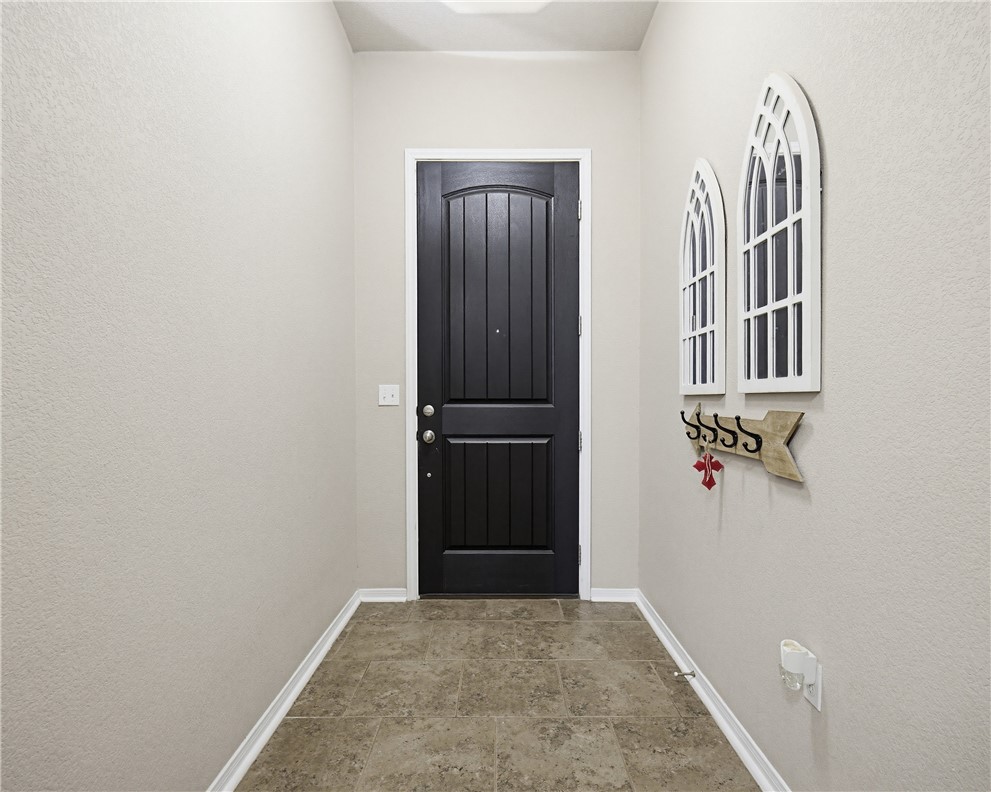 2129 Escondido Street Portland, TX 78374 - Photo 5 of 29 an empty room with windows