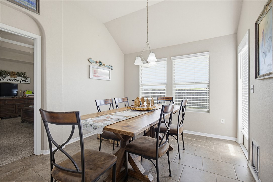 2129 Escondido Street Portland, TX 78374 - Photo 8 of 29 a view of a dining room with furniture and window
