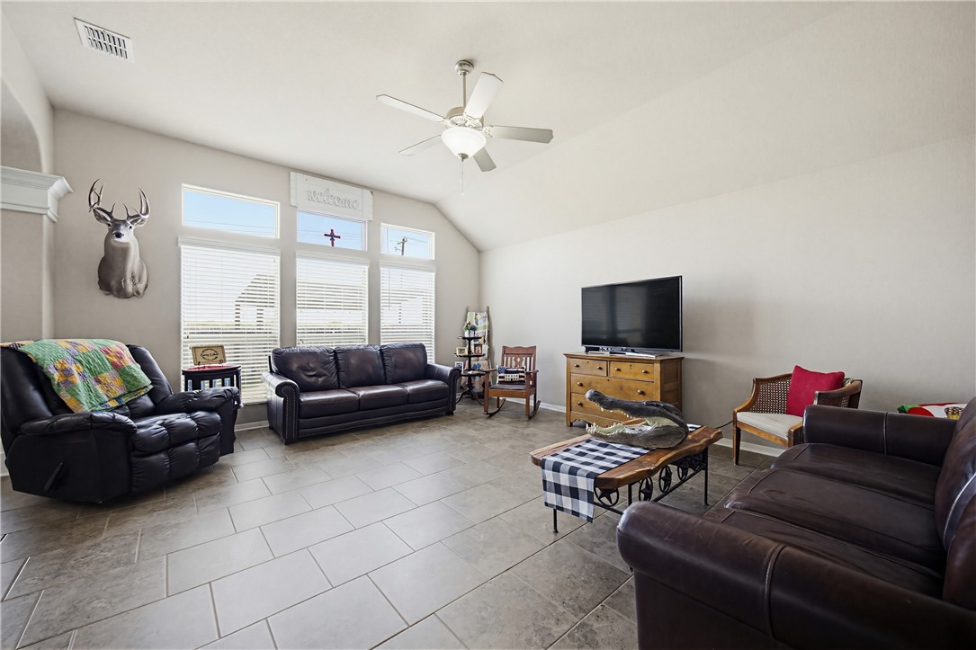 2129 Escondido Street Portland, TX 78374 - Photo 9 of 29 a living room with furniture and a flat screen tv
