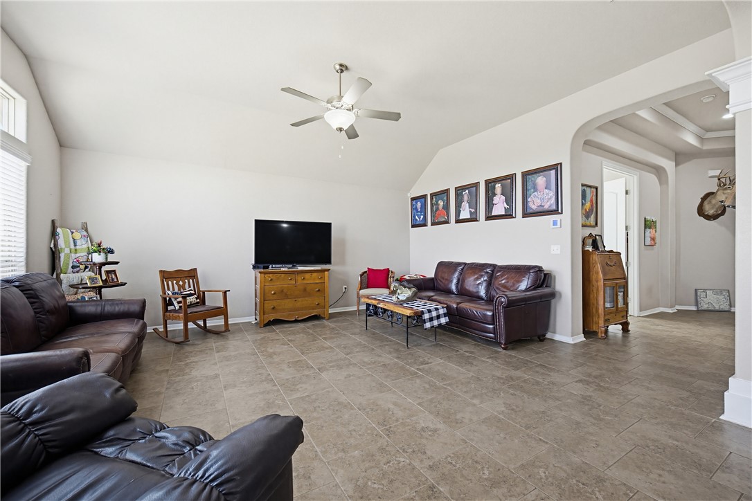 2129 Escondido Street Portland, TX 78374 - Photo 10 of 29 a living room with furniture and a flat screen tv