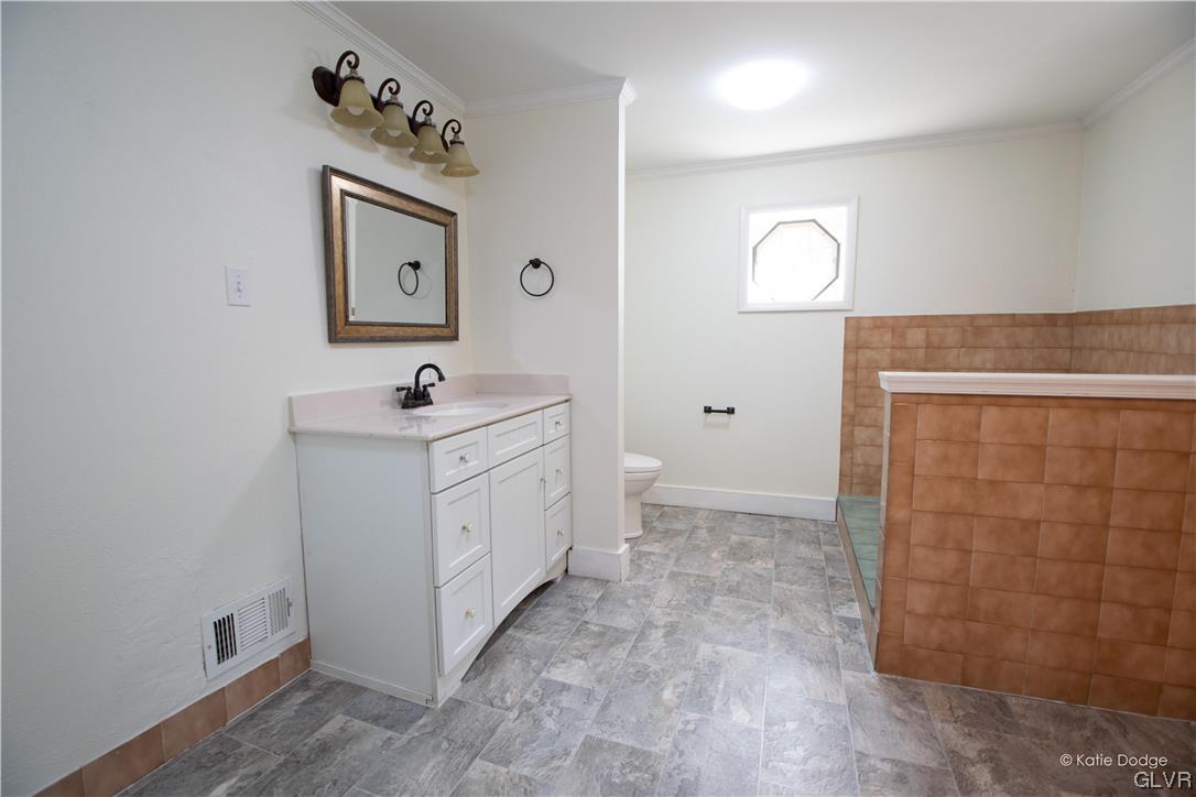 395 Buttermilk Road Easton, PA 18042 - Photo 12 of 41 a bathroom with a sink a toilet and mirror