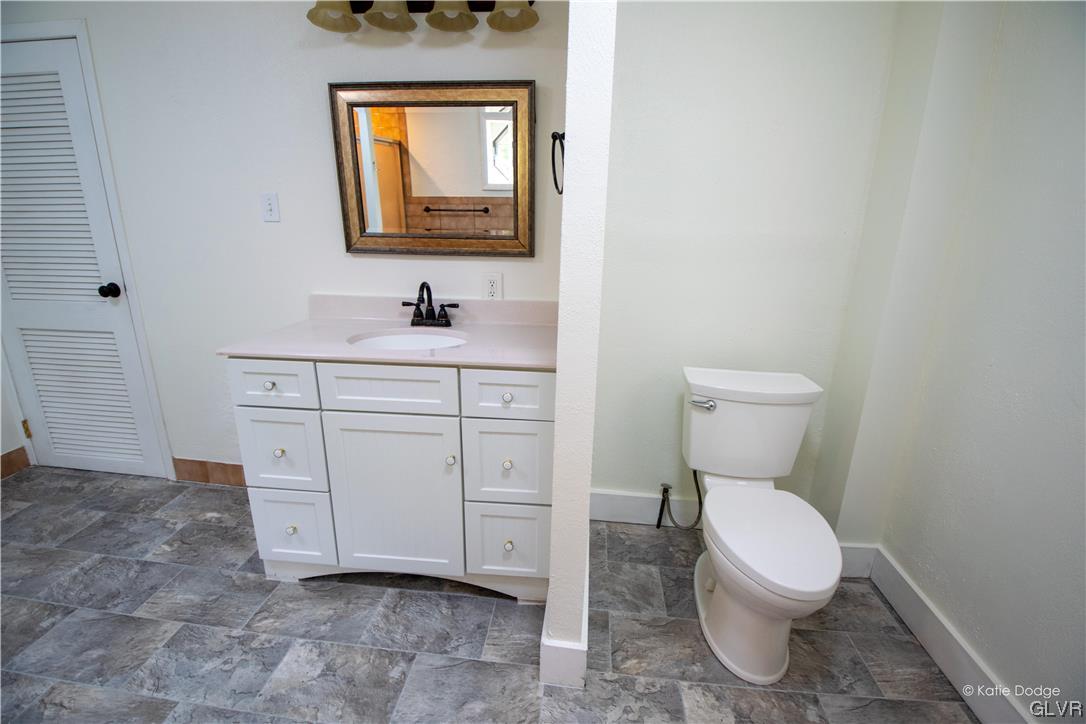 395 Buttermilk Road Easton, PA 18042 - Photo 14 of 41 a bathroom with a toilet a sink and mirror
