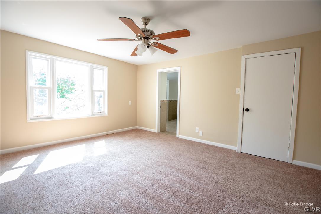 395 Buttermilk Road Easton, PA 18042 - Photo 17 of 41 a view of a livingroom with a ceiling fan and window
