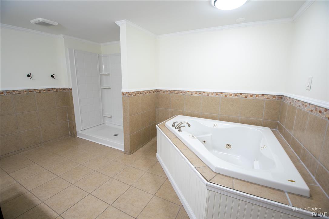 395 Buttermilk Road Easton, PA 18042 - Photo 18 of 41 a bathroom with a tub and shower
